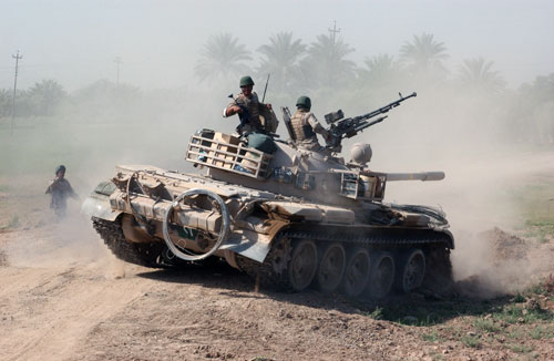 T55 of 1st Iraqi Mechanized Brigade Taking up a position while conducting 